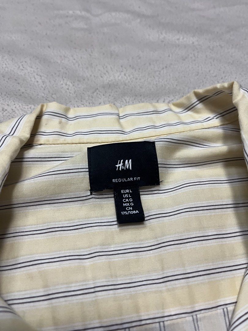 H&M Yellow Striped Button Down (Category: Shirts) located in Quezon City. Submitted by gvsfinds_ (Listing ID 1463492821, Image 3). Description: Cropped H&M yellow pinstripe button down. Size: L Dimensions: - Length: 25 - Width: 22.
