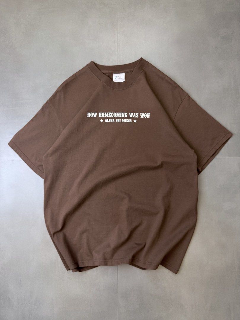 Homecoming chocolate brown tee shirt (Category: Tshirts & Polo Shirts ) located in Santa Rosa. Submitted by arvintage.ph (Listing ID 1463428224, Image 1). Description: Tagged: Large on tag Width 22” | Length 29” Condition: Excellent condition Issue(s): -.