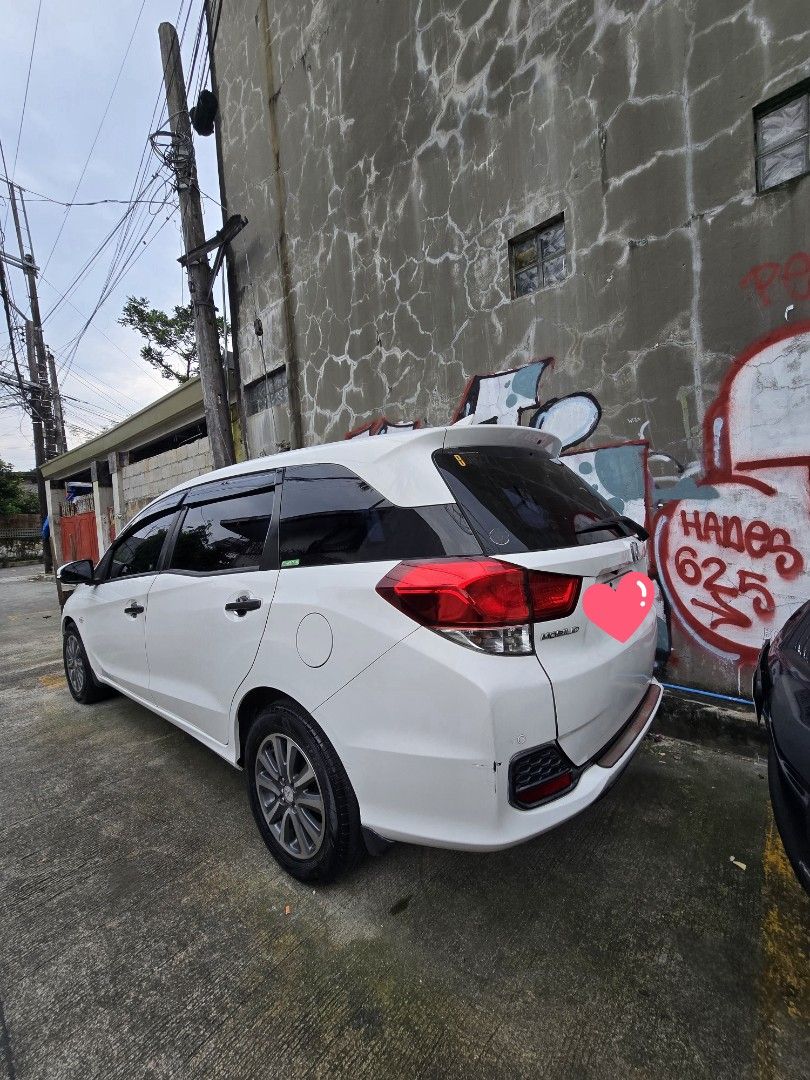 Honda Mobilio MT 1.5 E Manual (Category: Used Cars) located in Quezon City. Submitted by kylaricci (Listing ID 1463528241, Image 2). Description: HONDA MOBILIO 1.5 E 2016 Manual Transmission 📍 Project 4, Quezon City 💰 ₱375,000 SLIGHTLY NEGOTIABLE ✨ 1ST OWNER — LOW MILEAGE — WELL MAINTAINED Vehicle Details: • ⚙️ Manual Transmission • 📏 55,000 KM only • 🎨 Tafeta White • 👤 1st Owner • 👨‍👩‍👧‍👦 7-Seater • ✅ Good running condition • ✅ Clean an