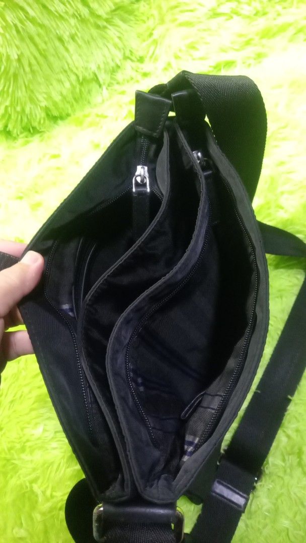 Hotwind Black Nylon Crossbody Bag (Category: Cross-body Bags) located in Manila. Submitted by twinklelyn03 (Listing ID 1463388356, Image 2). Description: - Brand: Hotwind - Color: Black - Material: Nylon - Style: Crossbody bag - Features: Multiple interior compartments for organization - Strap: Adjustable with leather accents - Closure: Leather accents - Ideal for: Everyday use, carrying essentials see photos for details pm sa sure buyer only tha
