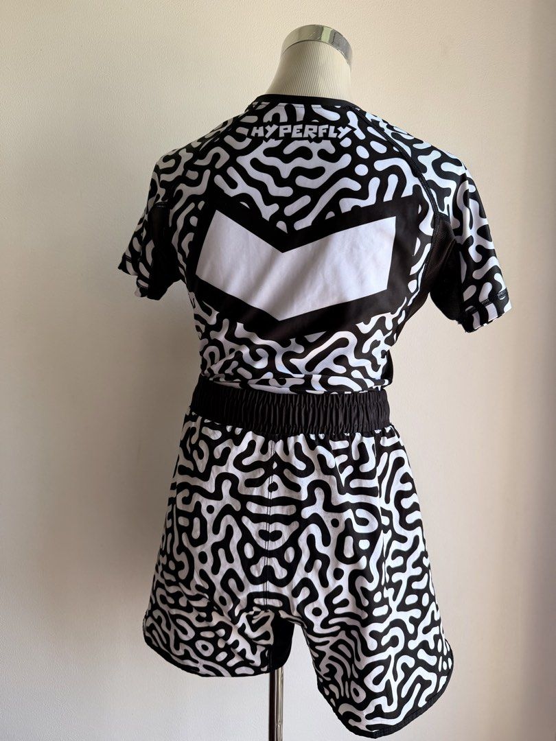Hyperfly celestial Rashguard Top & Shorts Set (Category: Other Sports Equipment and Supplies) located in Manila. Submitted by superbaba209 (Listing ID 1463357921, Image 2). Description: - Hyperfly rashguard set: includes top and shorts. - Unique black and white maze pattern. - Hyperfly logo on the back of the top. - Shorts feature an elastic waistband for comfort. - Ideal for training sessions or casual wear..