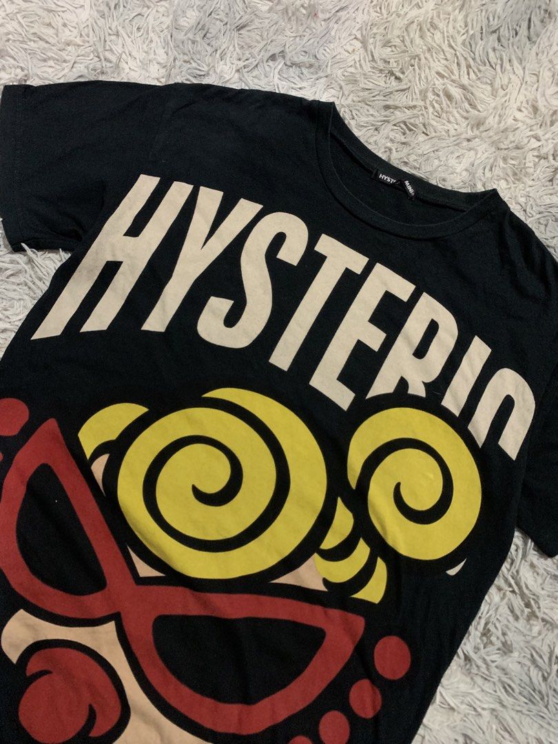 Hysteric Mini Black Graphic T-Shirt (Category: Shirts) located in Cebu City. Submitted by ninyothrift (Listing ID 1463499135, Image 2). Description: - Black Hysteric Mini t-shirt - Features iconic Hysteric graphic on the front - Hysteric Glamour logo on the back - Made from soft cotton material - Ideal for everyday casual wear - Excellent condition - No issue.