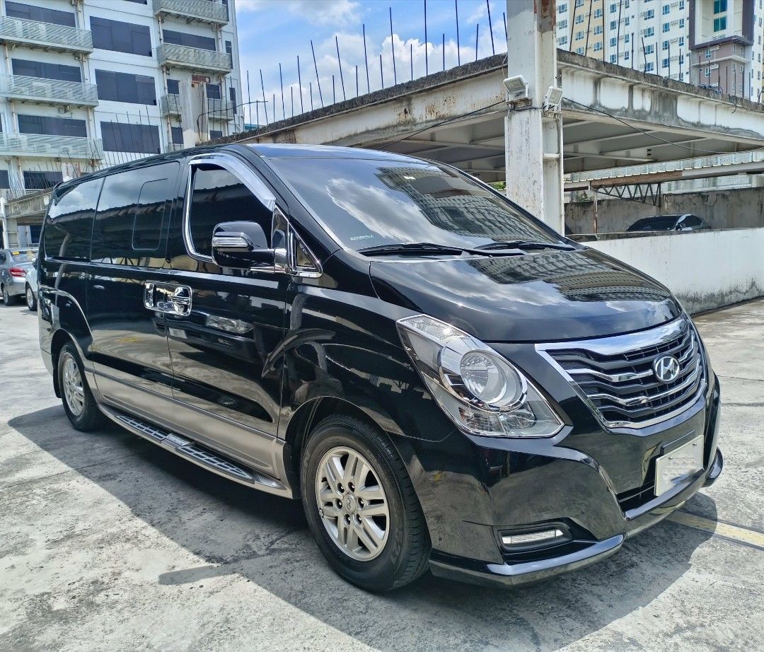 Hyundai Starex (Category: Used Cars) located in Manila. Submitted by itsjohnnicolas (Listing ID 1463378135, Image 2). Description: 2019 Hyundai Grand Starex Limited 2.5 Diesel Engine Automatic Transmission Mileage 61,400 Color Black 9 Seaters 16s Stock Mags Kumho thick tire Pioneer Headunit Headrest Monitor JBL Speakers TV Plus Cruize Dashcam Bosch Europa Horn Kostef Super Horn Led Headlight Ceramic Tint Leather Seat 2 Remote Key Complete Legal P