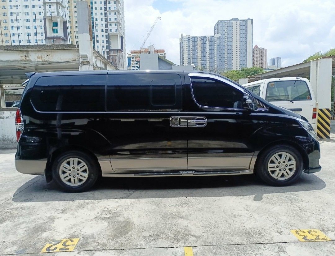 Hyundai Starex (Category: Used Cars) located in Manila. Submitted by itsjohnnicolas (Listing ID 1463378135, Image 3). Description: 2019 Hyundai Grand Starex Limited 2.5 Diesel Engine Automatic Transmission Mileage 61,400 Color Black 9 Seaters 16s Stock Mags Kumho thick tire Pioneer Headunit Headrest Monitor JBL Speakers TV Plus Cruize Dashcam Bosch Europa Horn Kostef Super Horn Led Headlight Ceramic Tint Leather Seat 2 Remote Key Complete Legal P