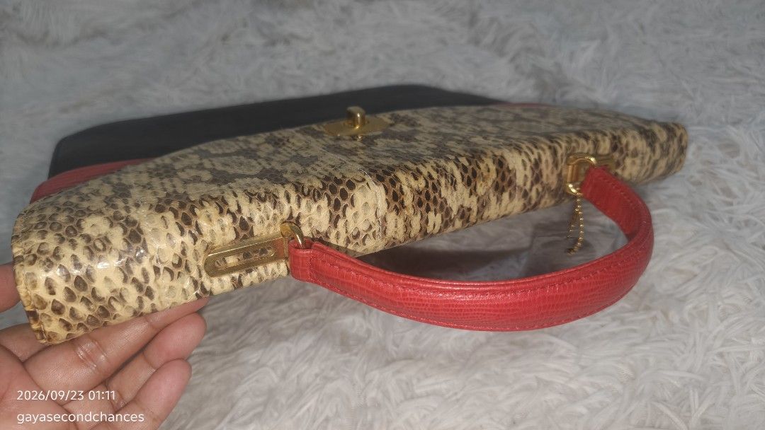 ICHICO CO. DOUBLE FLAP SNAKE ACCENT HAND BAG (Category: Tote Bags) located in Kalibo. Submitted by secondchances.thriftsh8p (Listing ID 1463530164, Image 3). Description: - Unique vintage handbag - Mix of snakeskin, red, and black textured leather - Gold-tone clasp closure - Red leather top handle - Interior zippered pocket - Makes a great statement piece for any outfit.