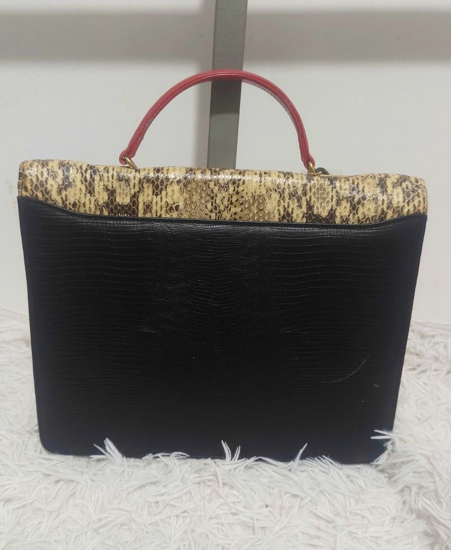 ICHICO CO. DOUBLE FLAP SNAKE ACCENT HAND BAG (Category: Tote Bags) located in Kalibo. Submitted by secondchances.thriftsh8p (Listing ID 1463530164, Image 2). Description: - Unique vintage handbag - Mix of snakeskin, red, and black textured leather - Gold-tone clasp closure - Red leather top handle - Interior zippered pocket - Makes a great statement piece for any outfit.