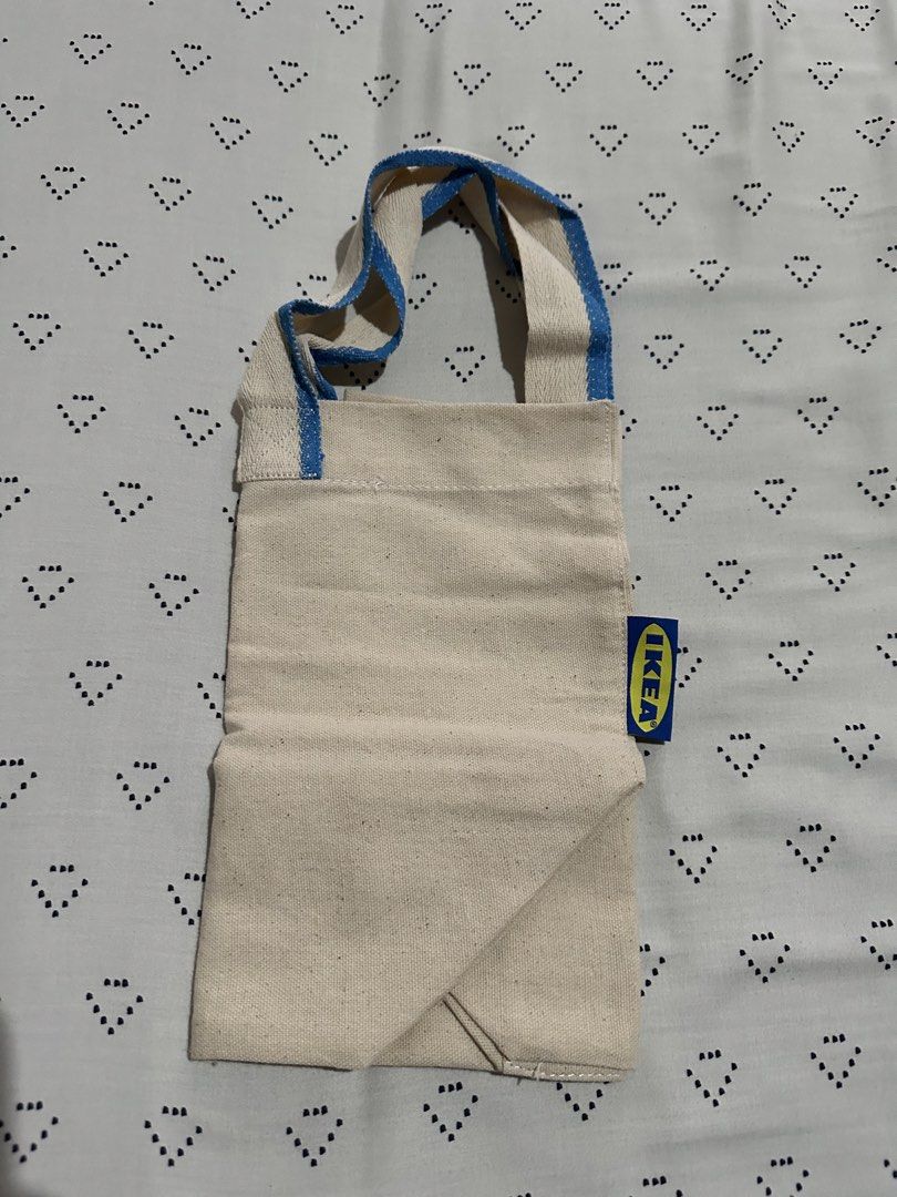 IKEA Spikrak Canvas Tote Bag with Blue Straps (Category: Tote Bags) located in Calapan. Submitted by shakalak (Listing ID 1463463741, Image 2). Description: - Authentic IKEA Canvas Tote Bag - Natural beige color - Blue striped handles - Ideal for groceries and everyday use - Easily foldable for storage - Made with durable material.