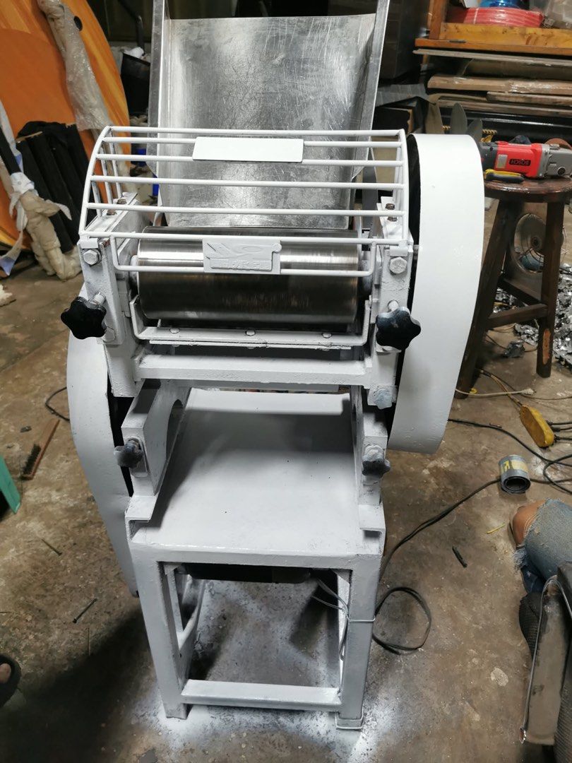 Industrial Dough Roller Machine for Sale (Category: Industrial Equipment) located in Manila. Submitted by marquezpa52205 (Listing ID 1463401893, Image 3). Description: - Heavy duty dough roller machine - Stainless steel hopper and rollers - Adjustable roller gap for various dough thicknesses - Sturdy metal frame for durability - Ideal for commercial kitchens and bakeries - Painted grey finish - Ready for immediate use.