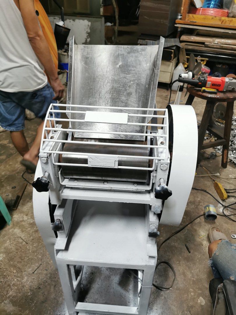 Industrial Dough Roller Machine for Sale (Category: Industrial Equipment) located in Manila. Submitted by marquezpa52205 (Listing ID 1463401893, Image 2). Description: - Heavy duty dough roller machine - Stainless steel hopper and rollers - Adjustable roller gap for various dough thicknesses - Sturdy metal frame for durability - Ideal for commercial kitchens and bakeries - Painted grey finish - Ready for immediate use.