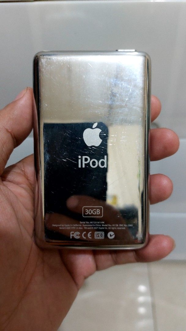 IPod Classic 5th Generation 30Gb (Category: Portable Music Players) located in Quezon City. Submitted by christopher.torio18 (Listing ID 1463368078, Image 3). Description: - iPod Classic 5th Generation - 30GB Storage Capacity - Color: White - Classic click wheel design - Shows minor cosmetic wear (scratches on back), as pictured - Fully functional music player - Same Imei on back plate - 802 songs loaded - For pick only, Deliver shipping fee shou