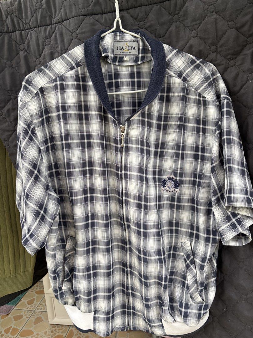 ITALYA INTERNATIONAL Plaid Zip-Up Jacket (Category: Coats, Jackets and Outerwear) located in Manila. Submitted by alphonse01 (Listing ID 1463536626, Image 1). Description: - Short-sleeved zip-up jacket - Classic plaid pattern - Navy blue collar and cuffs - Embroidered logo on chest - Two side pockets - Ideal for casual wear - Dimension: 27 x21 in Location: Angeles City Price: ₱350 + shipping fee.