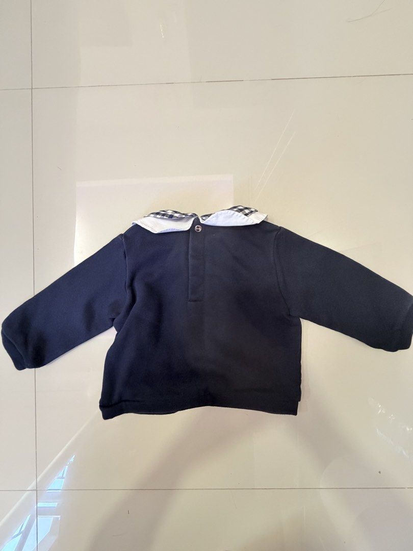 Jacadi Paris Navy Blue Long Sleeve Top with Gingham Collar (Category: Babies & Kids Fashion) located in San Juan, Ilocos Sur. Submitted by bpambid (Listing ID 1463344707, Image 2). Description: - Brand: Jacadi Paris - Color: Navy Blue - Style: Long sleeve top - Features: White and navy gingham Peter Pan collar - Closure: Snaps at the back for easy dressing - Origin: Made in France - Occasion: Great for everyday wear or special occasions.