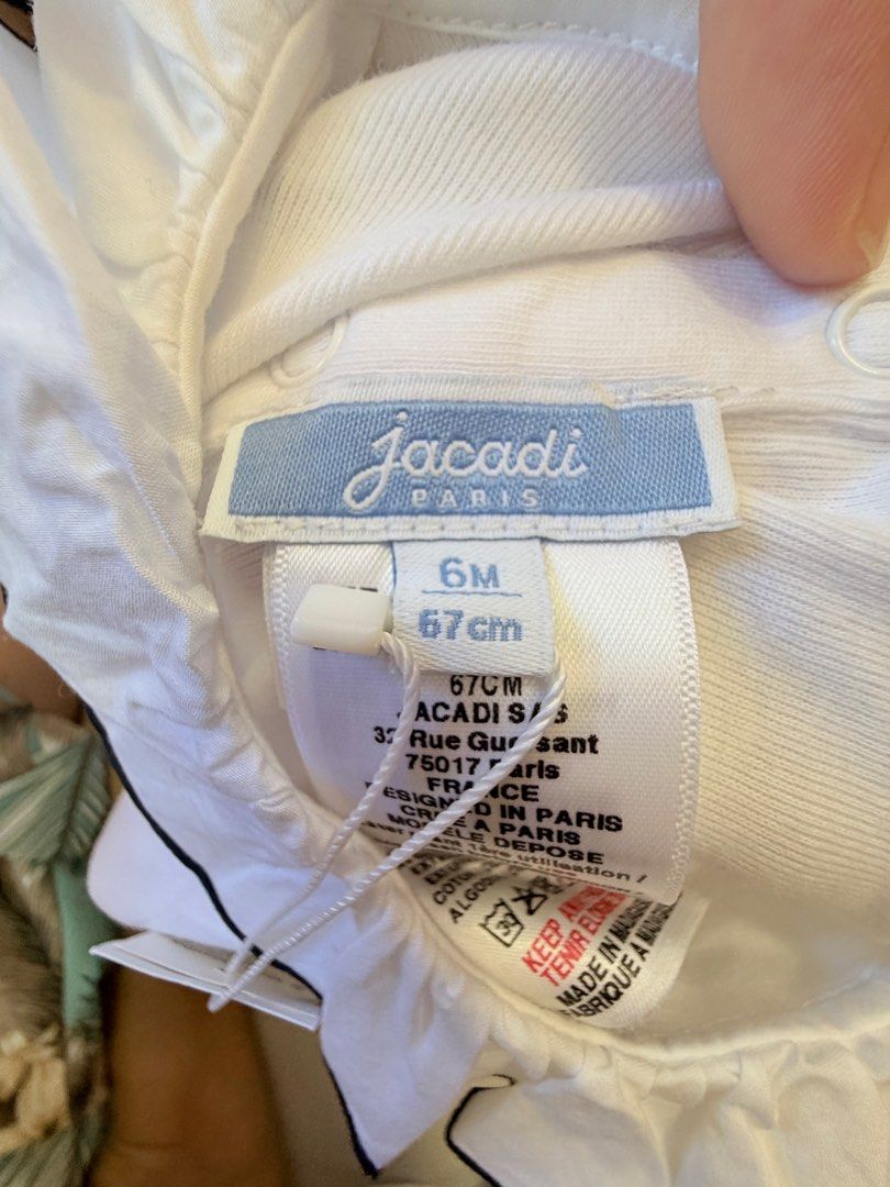 Jacadi Paris White Long Sleeve Bodysuit with Ruffle Collar (Category: Babies & Kids Fashion) located in San Juan, Ilocos Sur. Submitted by bpambid (Listing ID 1463348310, Image 3). Description: - Brand: Jacadi Paris - Color: White - Style: Long sleeve bodysuit - Features: Ruffled collar with black trim, snaps at bottom, button closure at back neck - Size: 6 months / 67cm - Perfect for your little one!.