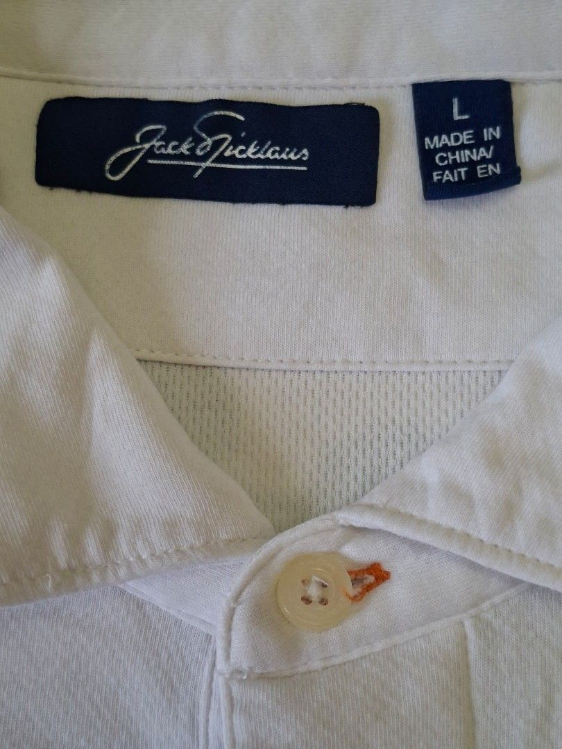 Jack Nicklaus Golf White Polo Shirt (Category: Activewear) located in Rizal. Submitted by carou66859 (Listing ID 1463338307, Image 2). Description: The image shows a white Jack Nicklaus Golf Polo Shirt in a men's size large with a single-button placket and woven collar detail.Size 23 inches width and 29 inches length.Price 375 only.Rizal area.Shipping sagot ng buyer.The price of a brand-new Jack Nicklaus men's white golf polo shirt typically rang