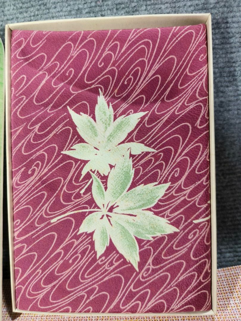 Japanese Maple Leaf Pattern Fabric in Box (Category: Everything Else Others) located in San Leonardo. Submitted by burgossanleonardo.12345 (Listing ID 1463465198, Image 1). Description: - Beautiful fabric with Japanese maple leaf and wave pattern. - Deep plum color with light green leaves and white waves. - Comes in original box. - Box features writing and a circular logo. - Ideal for crafting or decorative purposes..