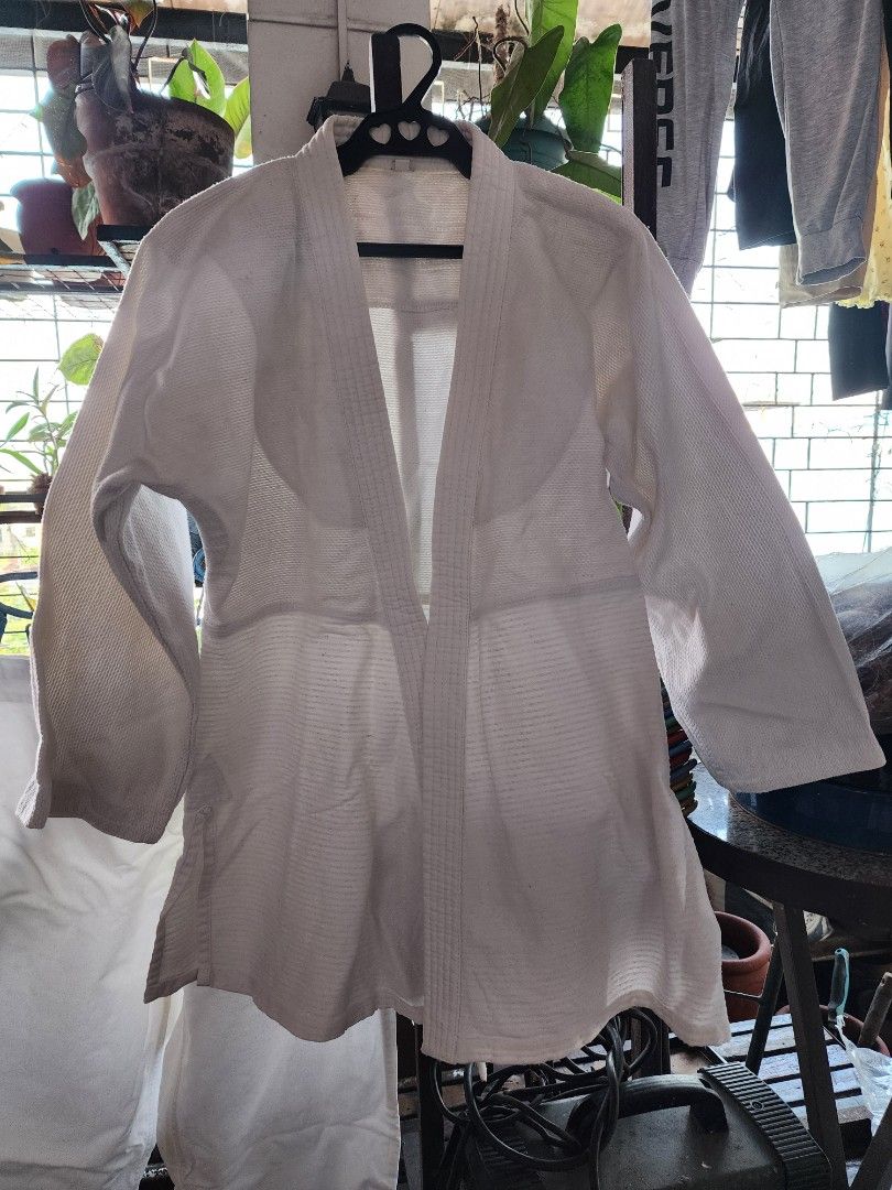 Jui Jutsu Martial Arts Jacket White (Category: Coats, Jackets and Outerwear) located in Meycauayan. Submitted by MP_Shop (Listing ID 1463337202, Image 1). Description: TOP Size: 19W x 30L inches Arm length: 20 inches Bottom: 40w x 33l inches may tali na adjustable Good Condition Color rate: 9/10 issue: need wash Loc: Meycauayan Bulacan Courier: J&T Mop: Gcash.