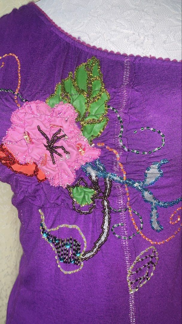 JuneJulyaguste Purple One-Shoulder Top Size S (Category: Sleeveless) located in Dagupan City. Submitted by sj_styles0910. (Listing ID 1463530949, Image 2). Description: - Elegant purple one-shoulder top - Delicate floral embroidery and bead embellishments - Unique scalloped neckline - Size: S - Authentically made in France.