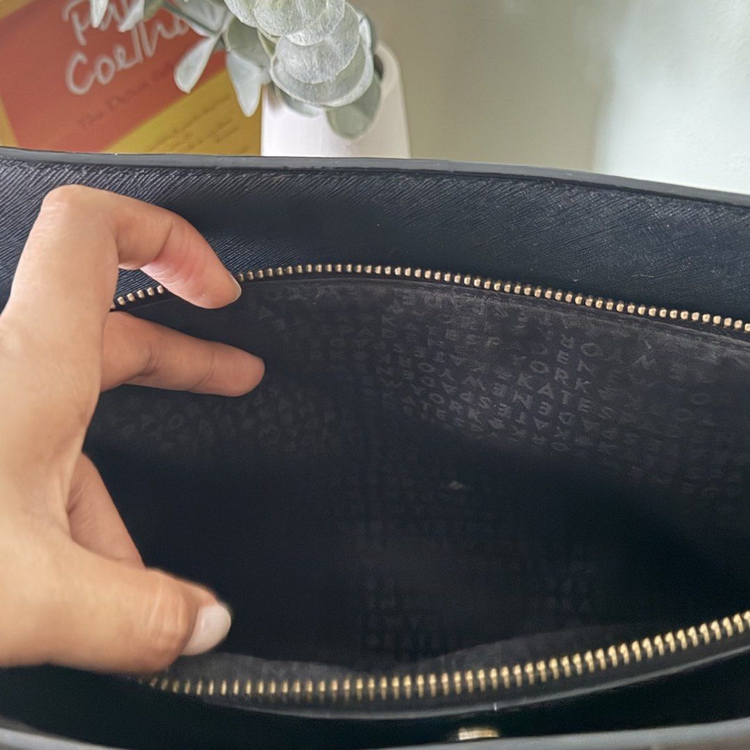 Kate Spade Black Leather Tote Bag (Category: Tote Bags) located in Cebu City. Submitted by eynjlin (Listing ID 1463476019, Image 2). Description: - Classic black Kate Spade tote bag - Genuine Saffiano leather exterior - Ample interior space with multiple compartments - Secure zip closure - Elegant gold hardware details - Ideal for work or everyday use - Minor signs of wear on straps.
