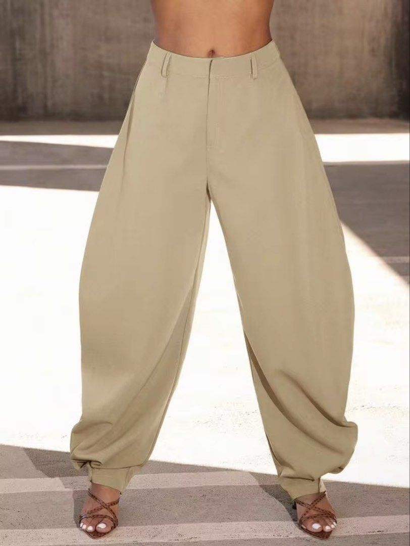 Khaki Barrel Pants with Button Detail (Category: Other Bottoms) located in Villasis. Submitted by juliaxgamboa (Listing ID 1463529777, Image 1). Description: - Khaki colored pants - Wide leg silhouette - Cinched ankle with two decorative buttons - Lightweight and flowy fabric - Versatile for casual or dressed-up occasions - Easy to style.