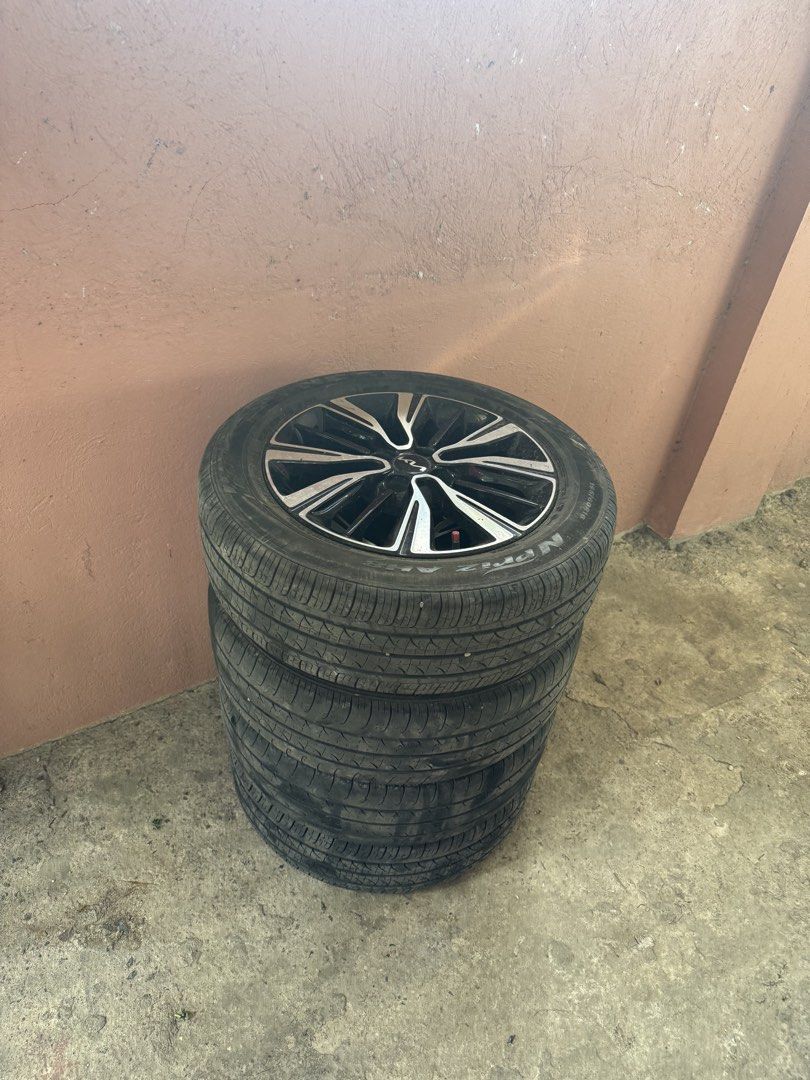 KIA STONIC ORIGINAL MAGS AND TIRES (Category: Mags and Tires) located in Cabuyao City. Submitted by mecdiones (Listing ID 1463326989, Image 2). Description: - Original Kia Stonic mags and tires - Color: Black with silver accents - Condition: Good - Compatible with Kia Stonic - Meetup at Bella Solana Subd., Cabuyao City - Included all the nuts - Personal car, changed tires and mags.