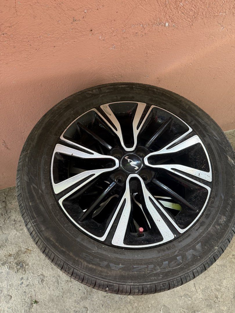 KIA STONIC ORIGINAL MAGS AND TIRES (Category: Mags and Tires) located in Cabuyao City. Submitted by mecdiones (Listing ID 1463326989, Image 1). Description: - Original Kia Stonic mags and tires - Color: Black with silver accents - Condition: Good - Compatible with Kia Stonic - Meetup at Bella Solana Subd., Cabuyao City - Included all the nuts - Personal car, changed tires and mags.