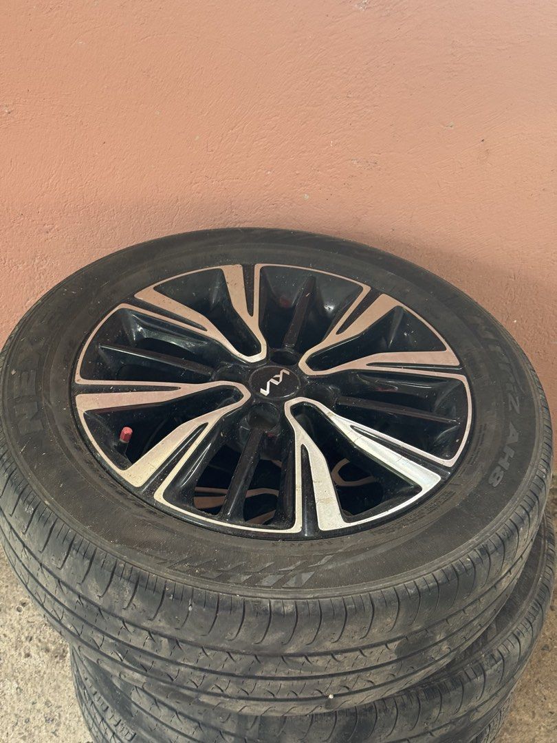KIA STONIC ORIGINAL MAGS AND TIRES (Category: Mags and Tires) located in Cabuyao City. Submitted by mecdiones (Listing ID 1463326989, Image 3). Description: - Original Kia Stonic mags and tires - Color: Black with silver accents - Condition: Good - Compatible with Kia Stonic - Meetup at Bella Solana Subd., Cabuyao City - Included all the nuts - Personal car, changed tires and mags.