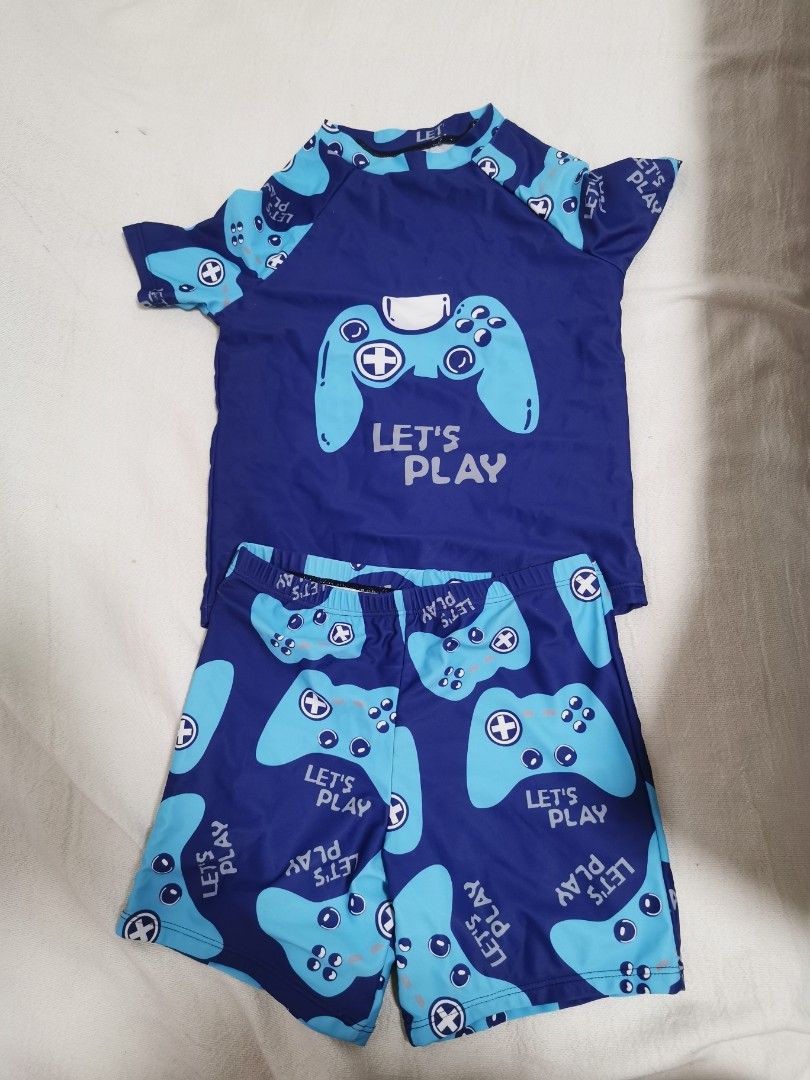 Kids Blue Gamer Controller Swimsuit Set (Category: Babies & Kids Fashion) located in Quezon City. Submitted by purplenest (Listing ID 1463378566, Image 1). Description: - Cool blue swimsuit set for kids - Fun gamer controller print - Includes rash guard top and swim shorts - Ideal for beach or pool fun - Let them play in style! For 4 to 5 years old .