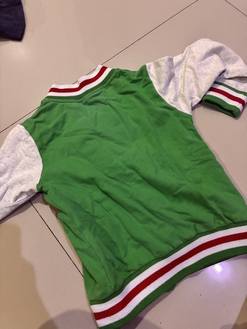 Kids Green Varsity Jacket with 'W' Patch (Category: Babies & Kids Fashion) located in Cagayan de Oro. Submitted by andreadominique (Listing ID 1463426655, Image 2). Description: - size 3-4 YO - Trendy green varsity jacket for kids - Light grey sleeves with ribbed cuffs and hem - Features a cool white 'W' patch on the chest - Easy snap button closure - Ideal for casual everyday wear RFS: decluttering.