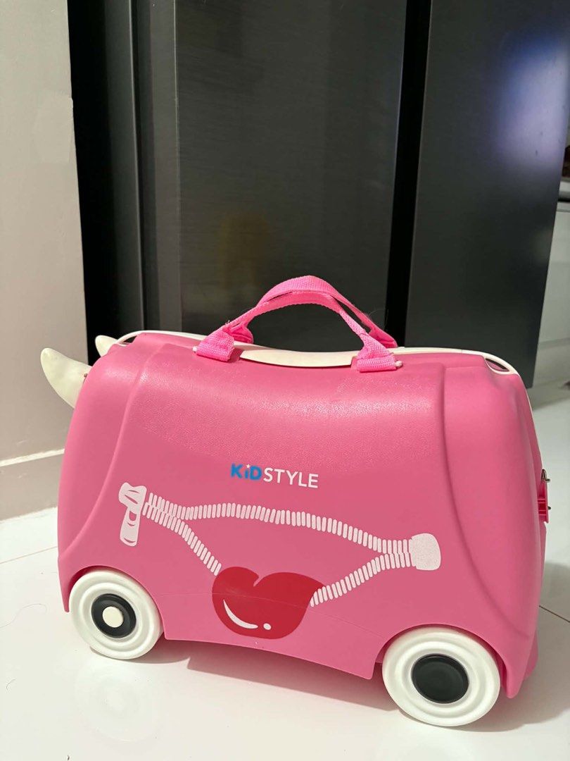 Kidstyle Pink Ride-On Suitcase with Wheels (Category: Luggage) located in Mandaluyong City. Submitted by kacbriz (Listing ID 1463427461, Image 1). Description: - Adorable pink ride-on suitcase for kids - Features a fun lip design and secure straps - Equipped with wheels for easy riding or pulling - Interior straps to keep belongings in place - Ideal for travel, vacations, and sleepovers - Encourages independence by letting kids pack their own ite