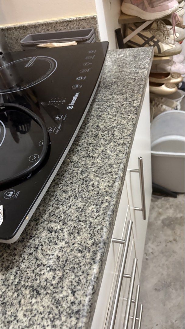 Kitchen Base Cabinets and countertop and backsplash granite (Category: Cookers) located in Mandaluyong City. Submitted by anjie52 (Listing ID 1463368725, Image 3). Description: 180cm L x 60cm W White kitchen base cabinets * Modern, flat-front design * 4 stacked drawers on the left * 1 single-door cabinet on the right * Long horizontal brushed-metal handles * Dark gray/black speckled granite countertop * Matching raised granite backsplash * Standa