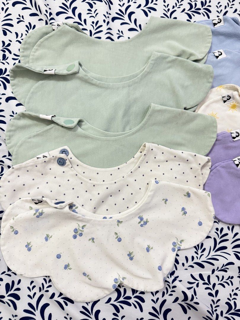 Konny Pastel Colors & Patterns bib (Category: Babies & Kids Fashion) located in Manila. Submitted by janelica220598 (Listing ID 1463375734, Image 3). Description: - Set of 4 baby bibs in soft pastel colors: light green, light blue, lavender, and white. - Adorable patterns including suns, blueberries, and polka dots. - Features both snap and button closures for a secure fit. - Made from soft fabric for maximum baby comfort. - Ideal for protecting 