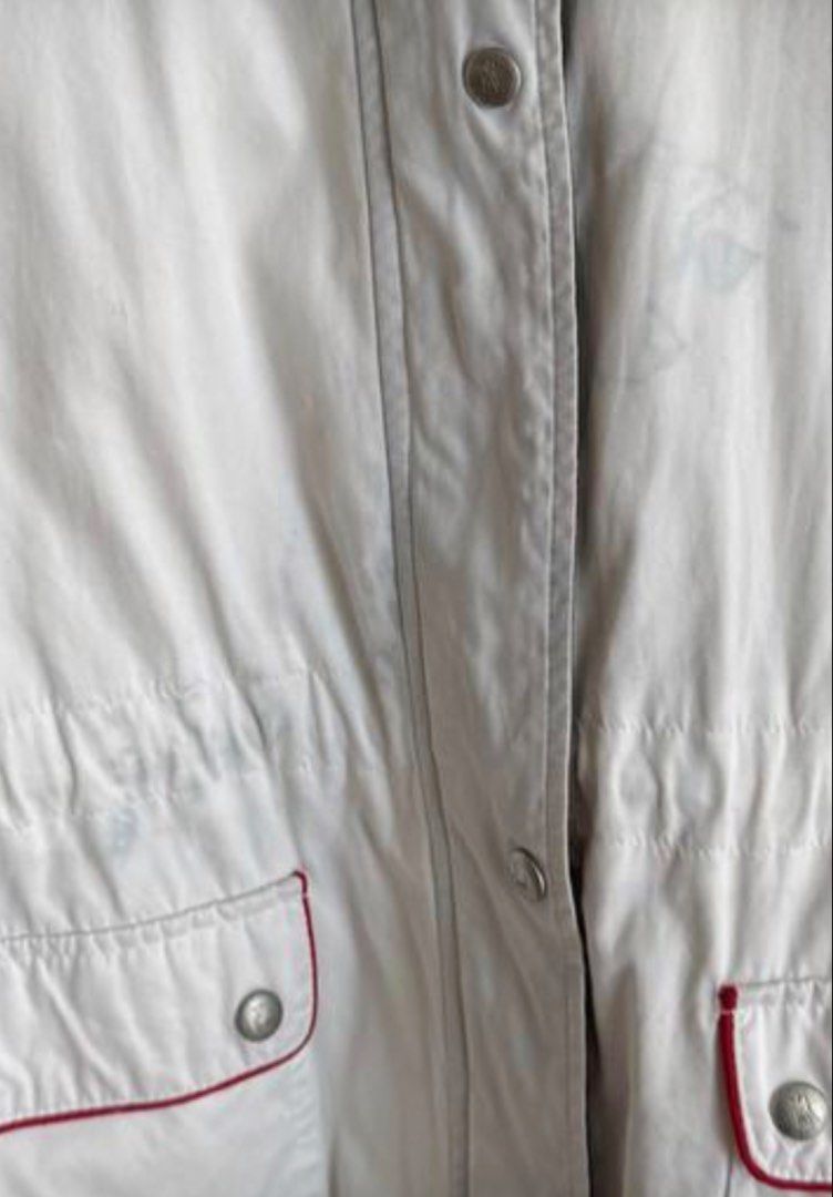 La Jaca White Hooded Jacket with Red Trim (Category: Coats, Jackets and Outerwear) located in Taguig. Submitted by anxmz (Listing ID 1463402393, Image 3). Description: - White hooded jacket from - Size 38 - Adjustable drawstring waist for a personalized fit - Two front pockets with stylish red trim detail - Some light stains on the front as pictured - Ideal for everyday casual wear.