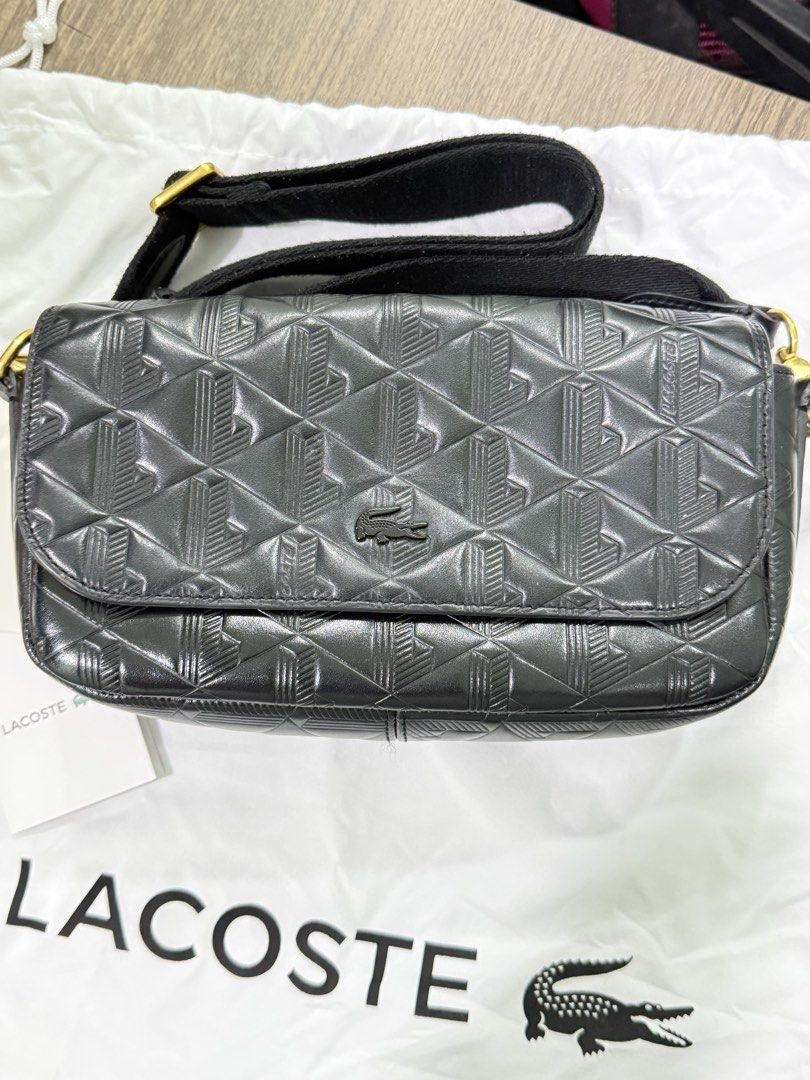 Lacoste Black Embossed Monogram Leather Crossbody Bag (Category: Cross-body Bags) located in Cavite. Submitted by jeanellajeweller (Listing ID 1463346639, Image 2). Description: with tag and care card with dust bag used but not well taken care of coor black with outside slip pocket kasya pro max can fit a lot (wallet, alcohol, cellphone,make up, wipes, keys) all pictures are uploaded and not edited (all actuals) Bought at Php 13,250 .