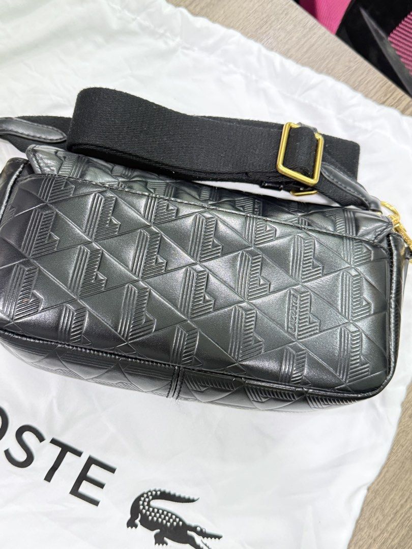 Lacoste Black Embossed Monogram Leather Crossbody Bag (Category: Cross-body Bags) located in Cavite. Submitted by jeanellajeweller (Listing ID 1463346639, Image 3). Description: with tag and care card with dust bag used but not well taken care of coor black with outside slip pocket kasya pro max can fit a lot (wallet, alcohol, cellphone,make up, wipes, keys) all pictures are uploaded and not edited (all actuals) Bought at Php 13,250 .
