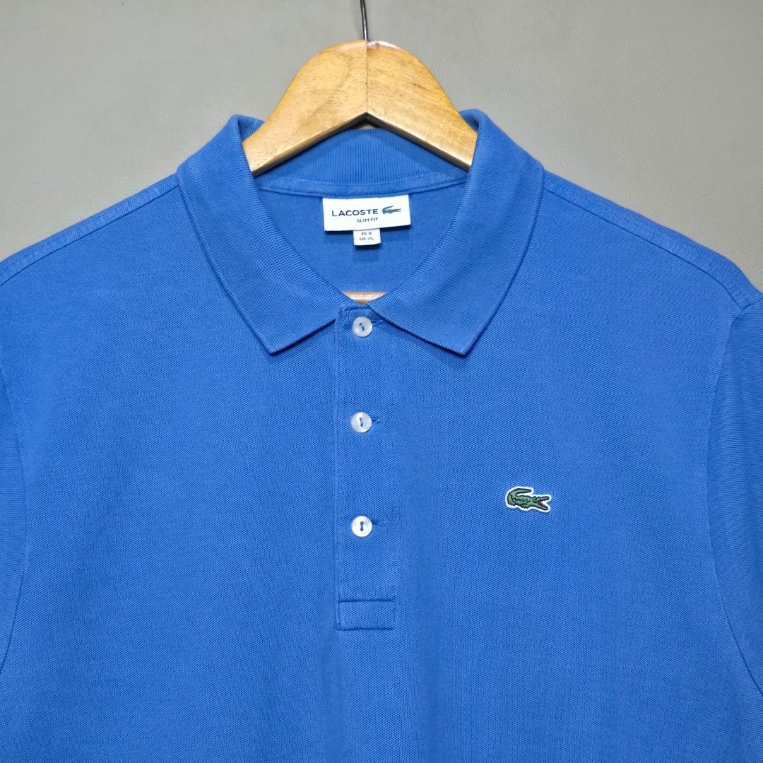 Lacoste Light Blue Polo Shirt (Category: Tshirts & Polo Shirts ) located in Quezon City. Submitted by somewearinmnl (Listing ID 1463527466, Image 2). Description: Lacoste Light Blue Polo Shirt - Size: 6/XL Slim Fit - Dimension: 21 W" x 28.5 L" - Excellent Condition - Color rate: 9.8/10 - No Issues - Color may vary due to lighting 📸.