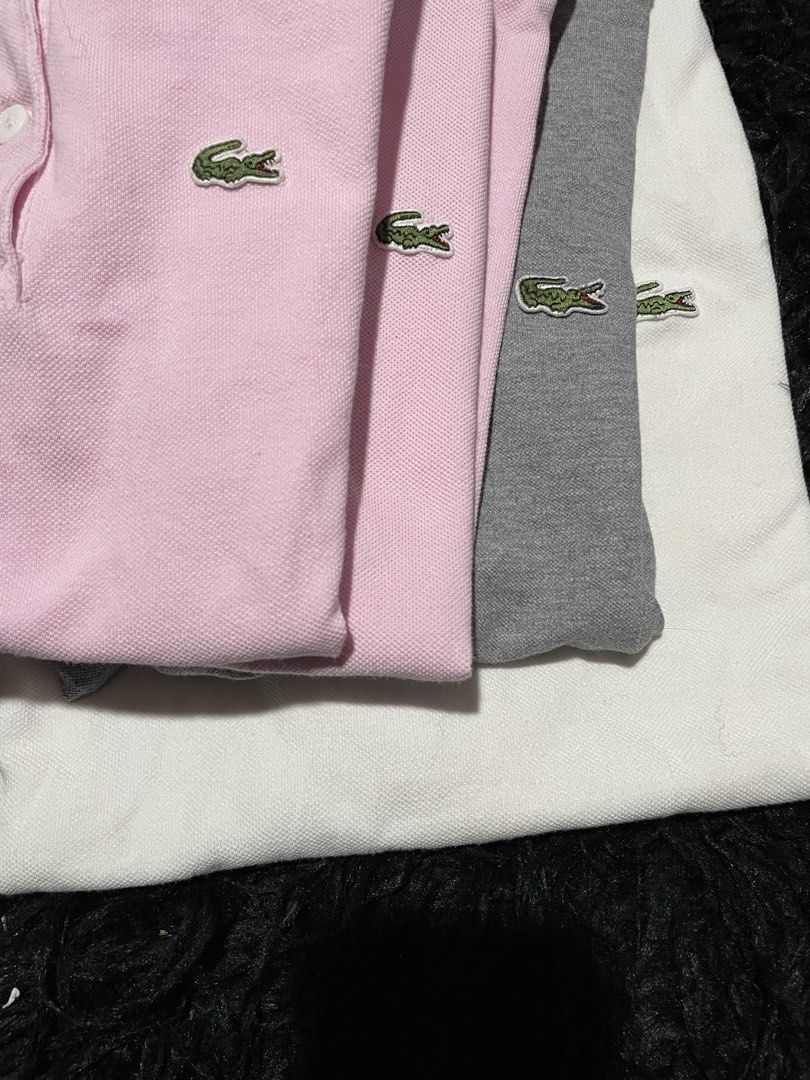Lacoste Polo Shirts - Pink & Grey (Category: Tshirts & Polo Shirts ) located in Munoz. Submitted by bb_jimbo0 (Listing ID 1463489033, Image 2). Description: - For Sale: Lacoste Polo Shirts - Available Colors: 2 Pink, 1 Grey - Features: Classic Crocodile Logo - Material: Good Quality Cotton - Style: Ideal for Casual or Sporty Looks - Condition: (Implicitly good, as it's a selling post) - Contact: Send a message if interested!.