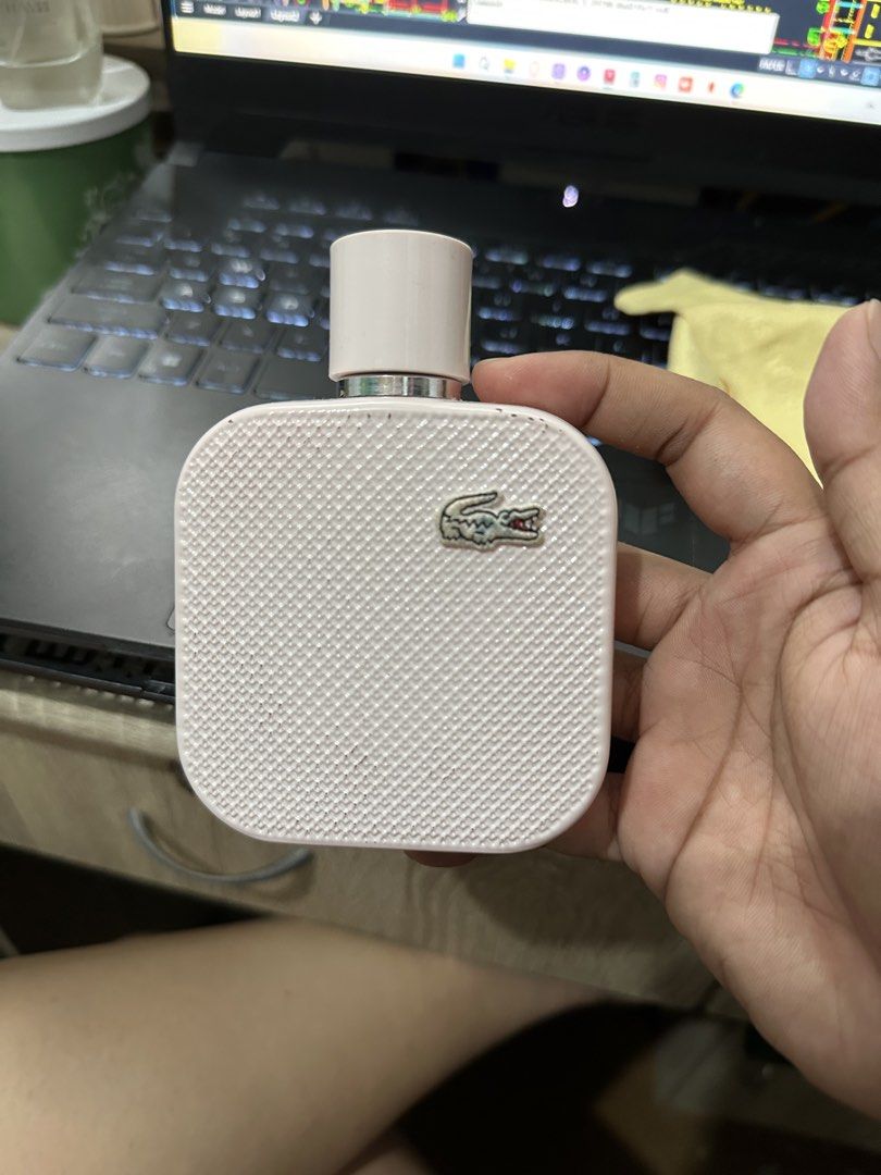 Lacoste Rose Eau de Parfum 100mL (Category: Fragrance & Deodorants) located in Pasig City. Submitted by prelovedniclrs (Listing ID 1463349359, Image 2). Description: - fruity floral scent (go-to scent!!) - authentic and long lasting - well used ( half the bottle bc it smells rlly good) - xmas gift from parents - scratches and stain on the logo bc i bring it with me always (prolly got it from the stuff i also have in my bag) - rfs: need funds - pr