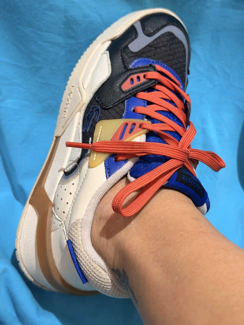 Lacoste Sneakers - Multi-Color (Category: Sneakers) located in Manila. Submitted by dangschoice (Listing ID 1463501746, Image 3). Description: Lacoste size 6 for women Slightly use and seldom use.Tayong tayo pa yung form niya. Ginamit lang for office pag naka casual :) - Cool Lacoste sneakers - Colorway: Black, white, blue, and orange - Unique design - Bright orange laces - Features the iconic Lacoste crocodile logo Slight issue: may maliit na cu