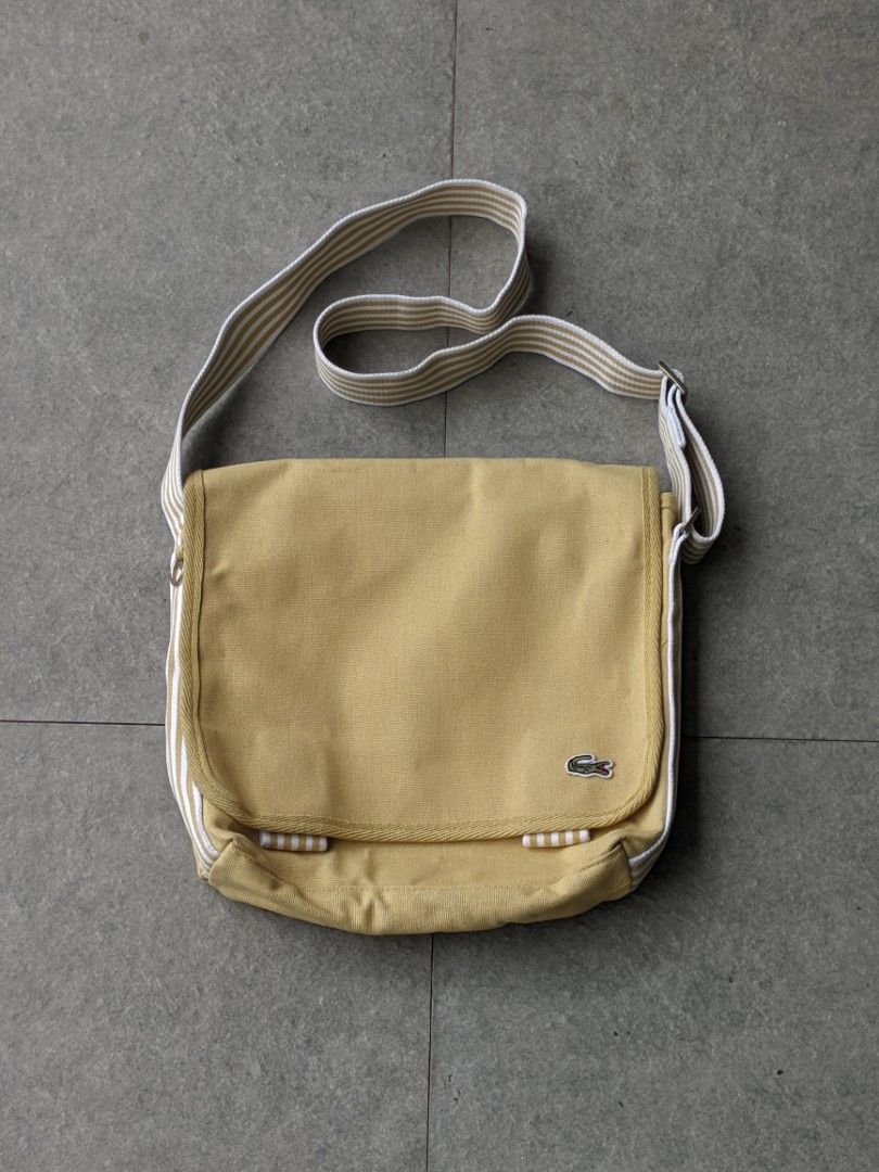 Lacoste Vintage Yellow Canvas Messenger Bag (Category: Cross-body Bags) located in San Mateo. Submitted by rick_enzo (Listing ID 1463524738, Image 1). Description: for sale original lacoste canvas messenger bag crossbody bag adjustable strap very good condition 2700 san mateo, rizal meetup within san mateo, or gma kamuning by sched delivery lalamove j&t first to pay, can vidcall — also selling more items, check profile.