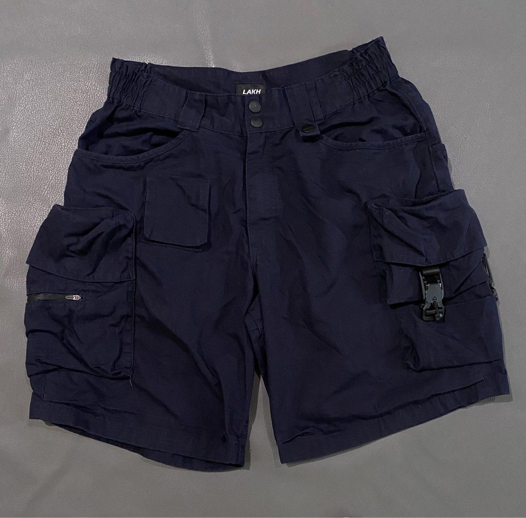LAKH Navy Cargo Shorts Size L (Category: Shorts) located in Pozorrubio. Submitted by izaykite2g (Listing ID 1463383905, Image 1). Description: - Navy blue LAKH cargo shorts - Size: Large (L) - 34 up to 36 actual waistline - 21.5 inches length - 14 inches leg opening - Features multiple pockets - Secure zip and buckle closures - Comfortable elasticated waistband - Ideal for everyday wear and outdoor activities.