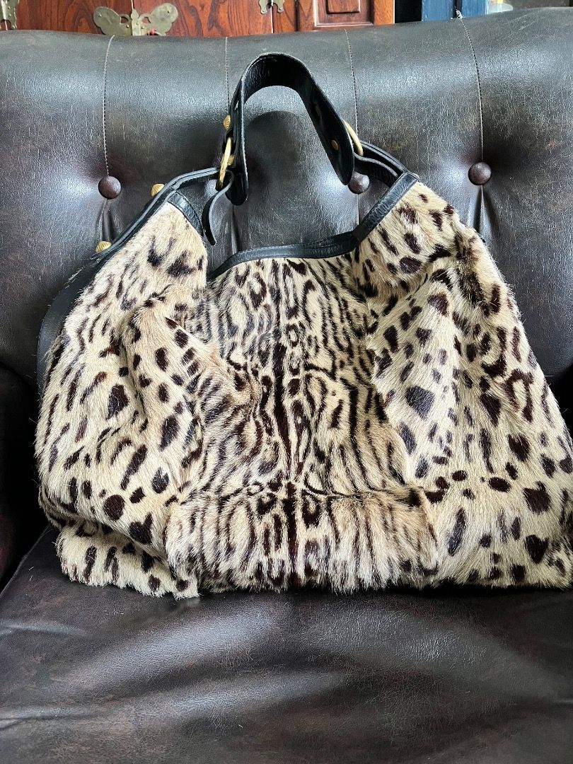 Leopard Print Fur & Leather Shoulder Bag (Category: Shoulder Bags) located in Makati City. Submitted by Ina_Ndang (Listing ID 1463335811, Image 2). Description: Leopard print hobo style/ hand/ shoulder bag Faux fur but genuine cowhide Brand is Escada 90s era This bag has been with me for years Used few times only Statement piece esp for fashionista Already outgrown that era With gold plated rivets/ring holders Has 3 pockets inside (2 open, 1 zipp