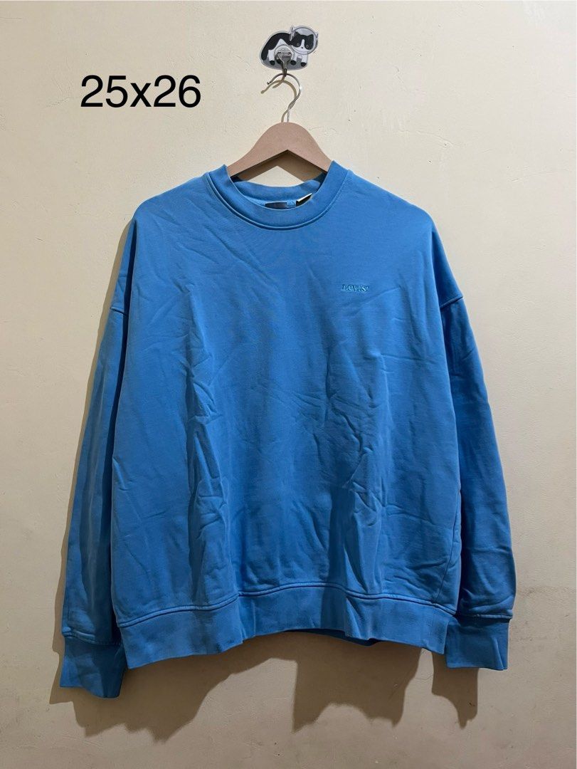 Levi's Blue Crewneck Sweatshirt Size M (Category: Coats, Jackets and Outerwear) located in Manila. Submitted by juspheroca82034 (Listing ID 1463416447, Image 1). Description: - Blue Levi's Sweatshirt - Size: Medium (M) - Origin: Made in Sri Lanka - Style: Great for casual wear - Features: Comfortable and stylish - Condition: Please check photos for details.