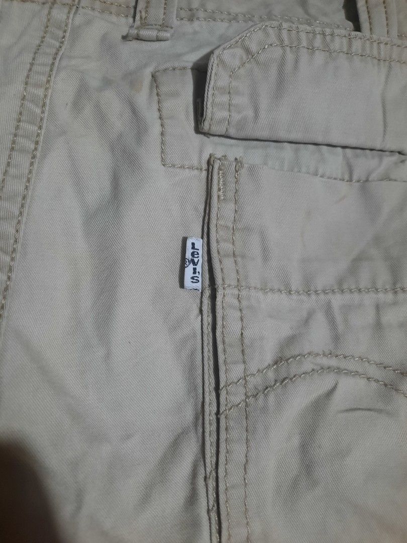 Levi's Cargo Shorts Size 38 Beige Cotton (Category: Shorts) located in Lapu Lapu. Submitted by markbel26 (Listing ID 1463515723, Image 3). Description: - Beige Levi's Cargo Shorts - Size: 38 - Material: 100% Cotton - Closure: Button and Zip - Features: Multiple pockets for ample storage - Ideal for: Casual wear, outdoor activities - Condition: Good.