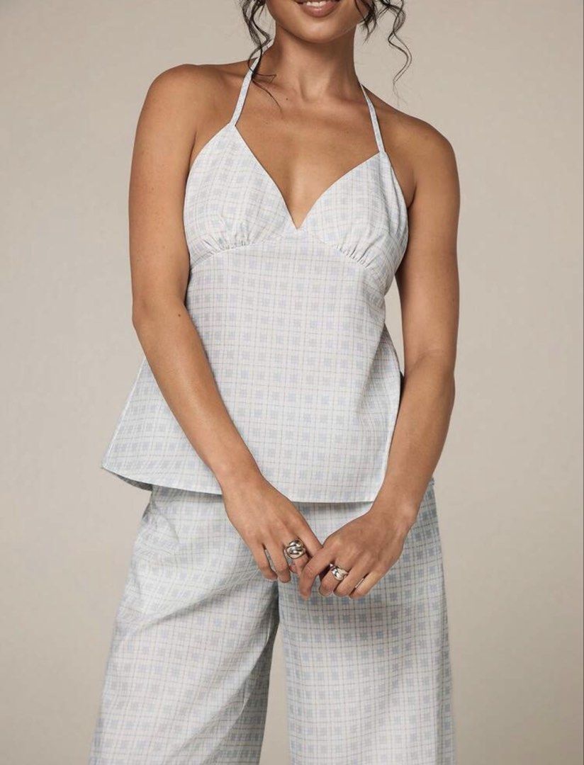 Light Blue Plaid Halter Neck Coords (Category: Sets or Coordinates) located in Villasis. Submitted by juliaxgamboa (Listing ID 1463525983, Image 2). Description: - Small to med - Halter neck camisole top with tie back - Wide leg pants with matching plaid pattern - Light and breathable fabric - Cute and relaxed look.