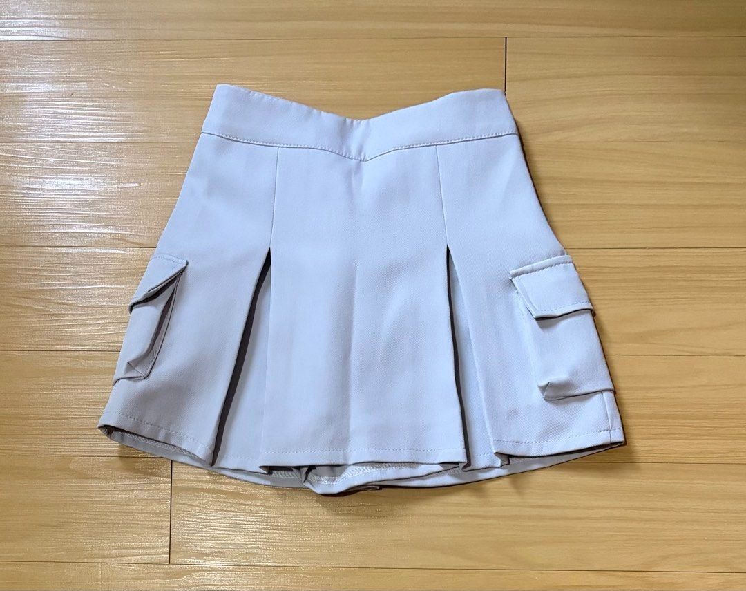Light Grey Cargo Pleated Skirt Size 25-30 (Category: Skirts) located in Quezon City. Submitted by garagesale2026 (Listing ID 1463336810, Image 1). Description: - Unused, washed - With built-in shorts - Garterized back waist - From Bangkok.