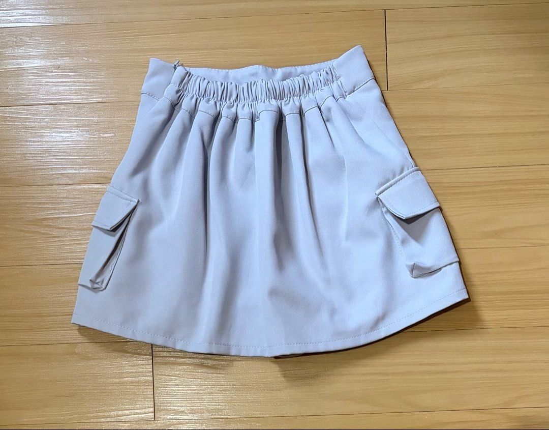Light Grey Cargo Pleated Skirt Size 25-30 (Category: Skirts) located in Quezon City. Submitted by garagesale2026 (Listing ID 1463336810, Image 2). Description: - Unused, washed - With built-in shorts - Garterized back waist - From Bangkok.