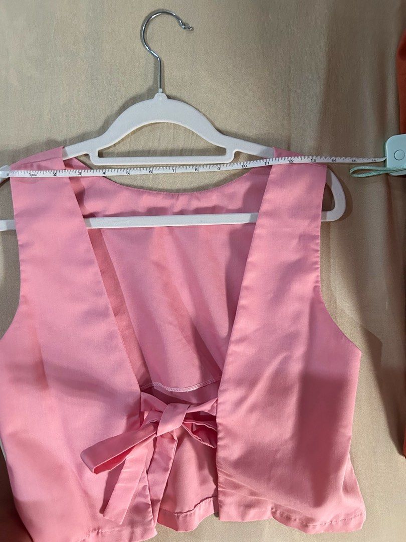 Linen Sleeveless Crop Top with Tie Back (Category: Sleeveless) located in Cainta. Submitted by unboxingstuff (Listing ID 1463429615, Image 3). Description: - Adorable pink sleeveless crop top - Linen; good quality - Chic tie-back closure at the back - Luxurious satin-linen material - Versatile for casual or dressed-up looks.