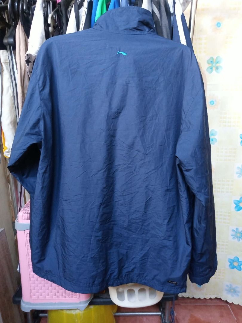 windbreaker Li-Ning (Category: Coats, Jackets and Outerwear) located in Pasig City. Submitted by rjkfindsofficial (Listing ID 1463411630, Image 3). Description: - Li-Ning Windbreaker - Color: Navy Blue with White & Light Blue Accents - Size: XXL - Dimes L29 x W24 - No issue - Complete tags - Material: 100% Polyester - Features: Full Zip Closure, Stand-Up Collar - Ideal for: Sports and Casual Wear.