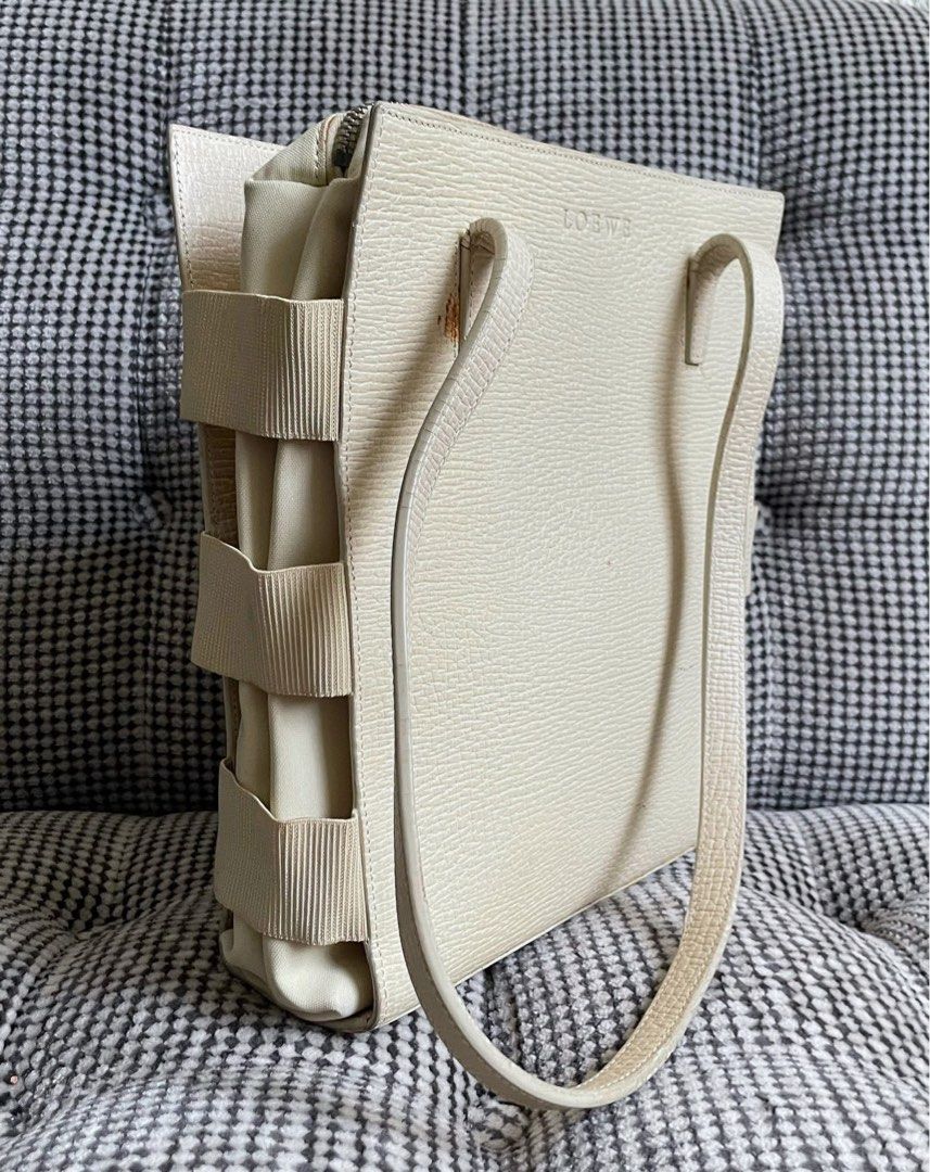 Loewe ivory leather cage style tote bag (Category: Shoulder Bags) located in Bulacan. Submitted by thriftbagcollections (Listing ID 1463442304, Image 3). Description: Loewe ivory leather cage style tote bag,good condition with some signs of usage only.Approx:H-9.5”W-8”D-2.5” handle 11”.