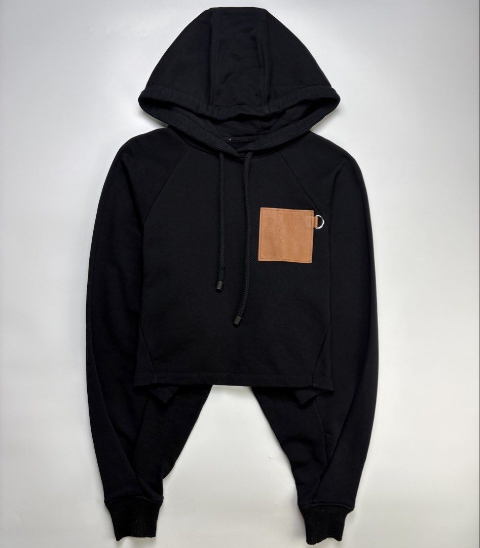Loewe Leather Anagram Patch Cropped Hoodie (Category: Coats, Jackets and Outerwear) located in Cavite. Submitted by sc_rcity (Listing ID 1463333766, Image 2). Description: Tagged Size : XS Women’s Guaranteed Authentic | Moneyback Guaranteed Like New Flaw : Missing Main Label/Tag , Slight Distressed on the right lace Made in Portugal No Inclusion Characterized by its boxy, cropped silhouette, dropped shoulders, long batwing sleeves, and a prominen